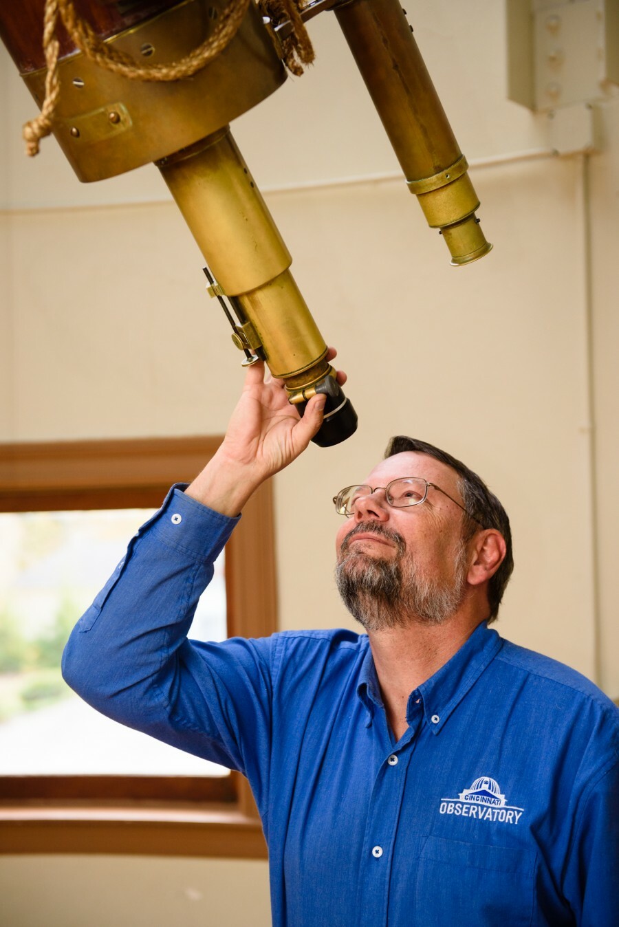 Craig Niemi looking through telescope