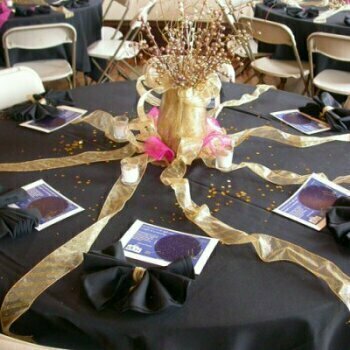 Table decorated with black, pink, and gold décor