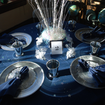 Tables decorated with blue décor and table settings